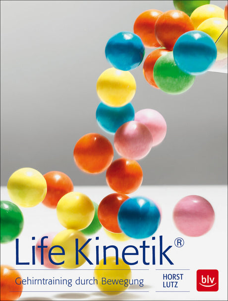 Bunte Kugeln in der Luft, auf einem weißen Hintergrund, mit Buchtitel "Life Kinetik" und Untertitel auf Deutsch.