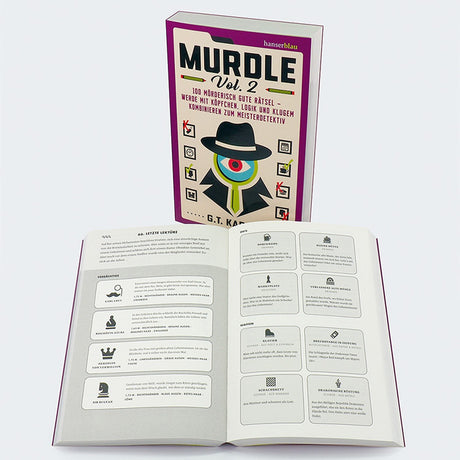 Buch mit Titel "Murdle Vol. 2" und offenes Heft mit Rätseln und Beschreibungen.