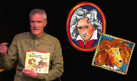 Mann hält Buch "Herr Beethoven macht Musik" vor sich, im Hintergrund Porträts von Beethoven und Leo Lionni.