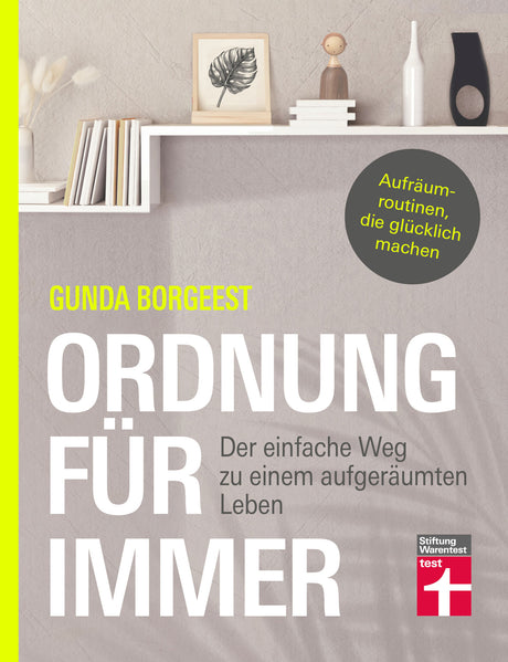 Buchcover mit weißen Regalen, Dekorationen und dem Titel "Ordnung für immer" von Gunda Borgeest, Fokus auf Ordnung und Aufräumen.